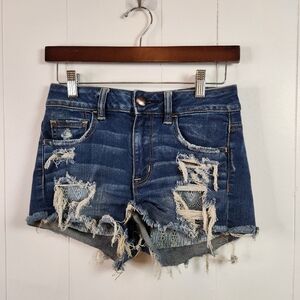 American Eagle High Rise Shortie Jean Shorts Ripped Eyelet Lined Size 4 Festival